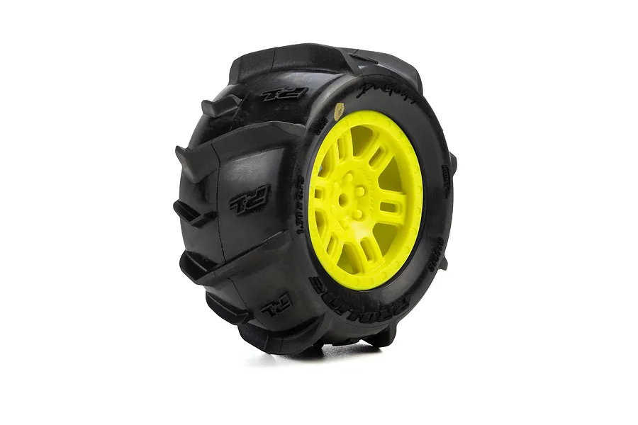 Pro-Line Dumont paddle tyre mounted on a yellow split-six plastic wheel against a clean white background.