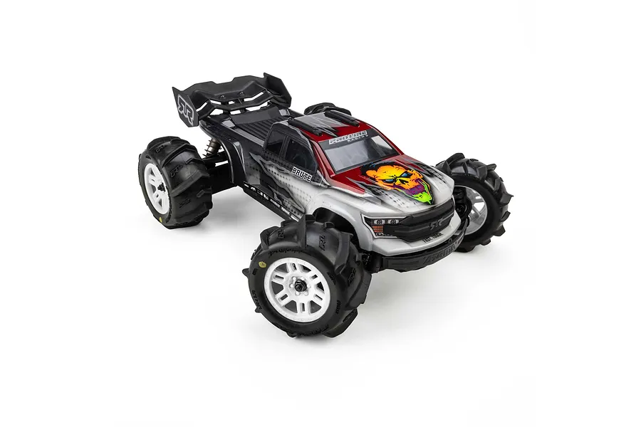 Pro-Line RC monster truck fitted with Dumont MT paddle tyres on white split six rims against a white background.