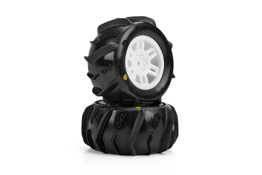Pro-Line 1/16 Dumont MT paddle tyres mounted on white split-six rims, presented as a pair of glued wheels against a white background.