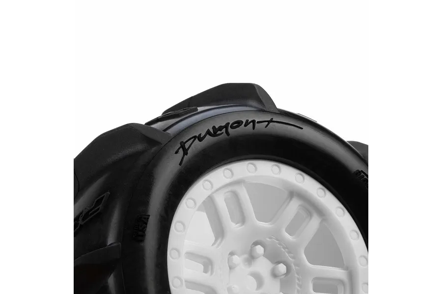 Close-up detail of Pro-Line Dumont paddle tyre mounted on a white split-six rim against a plain background.