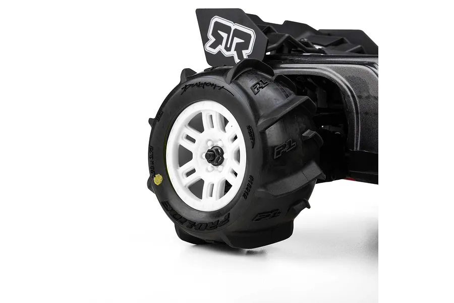 Pro-Line Dumont MT paddle tyre mounted on a white split-six rim installed on an RC vehicle against a white background.