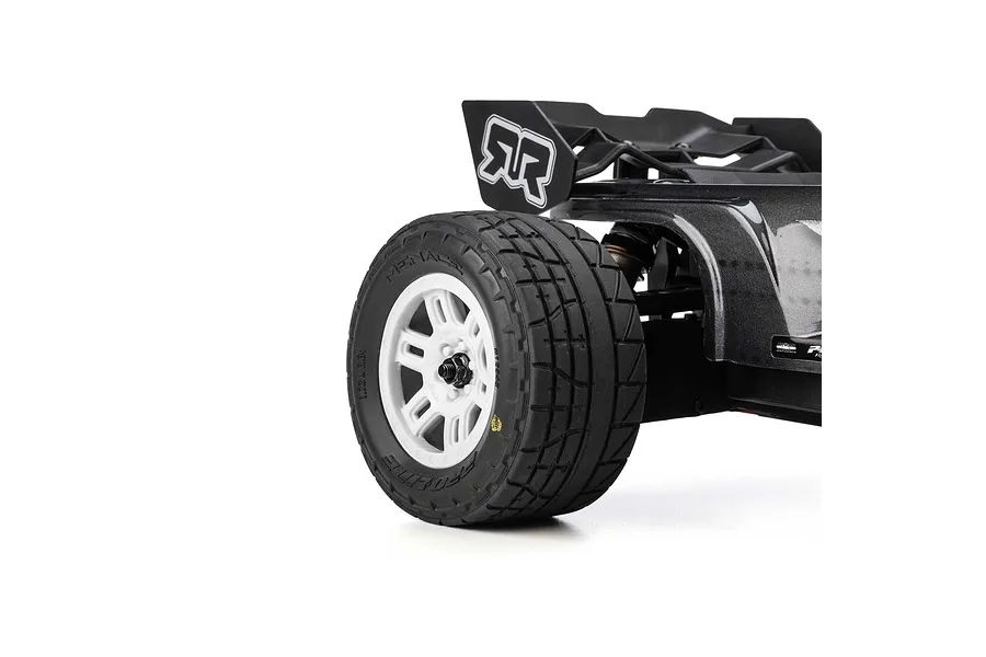 Close-up of a Pro-Line Menace street tyre mounted on a white split-six rim installed on an RC car against a white background.
