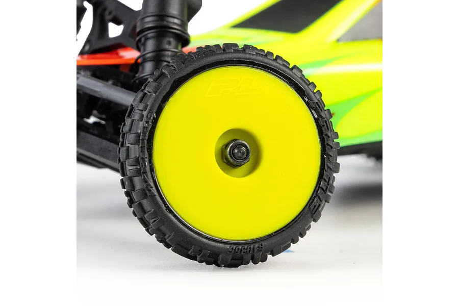 Close-up of a Pro-Line RC car wheel with a black treaded tyre and yellow dish rim mounted on a buggy.