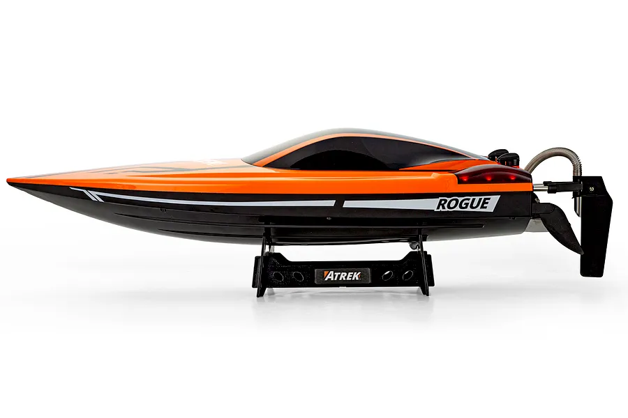 Side profile view of the Atrek Rogue 22-inch orange and black RC speed boat resting on a matching display stand against a white background.