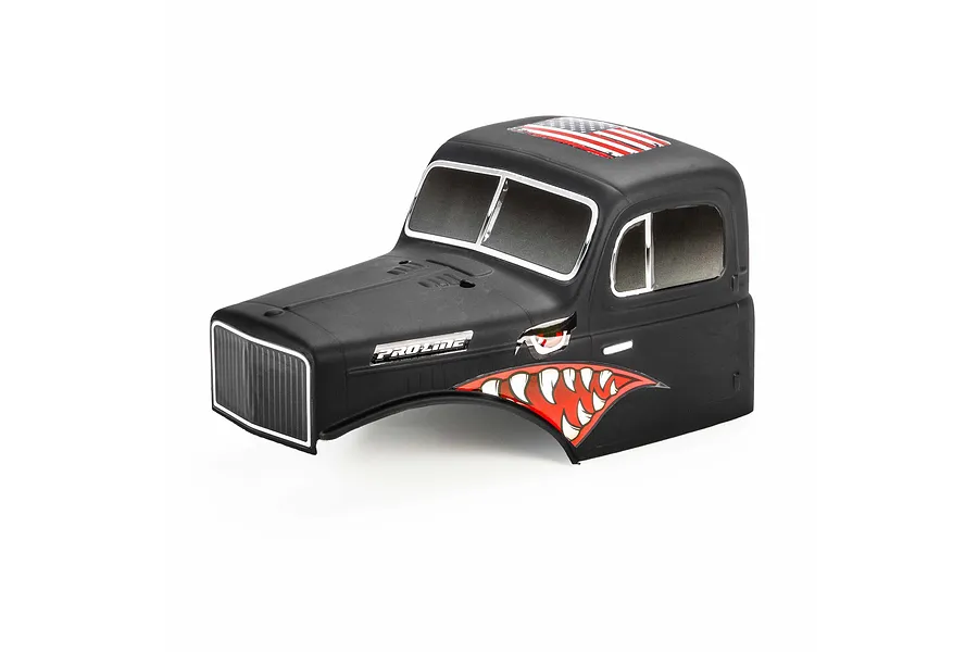 Pro-Line matte black cab-only crawler body shell with American flag graphic and shark teeth decals on a white background.