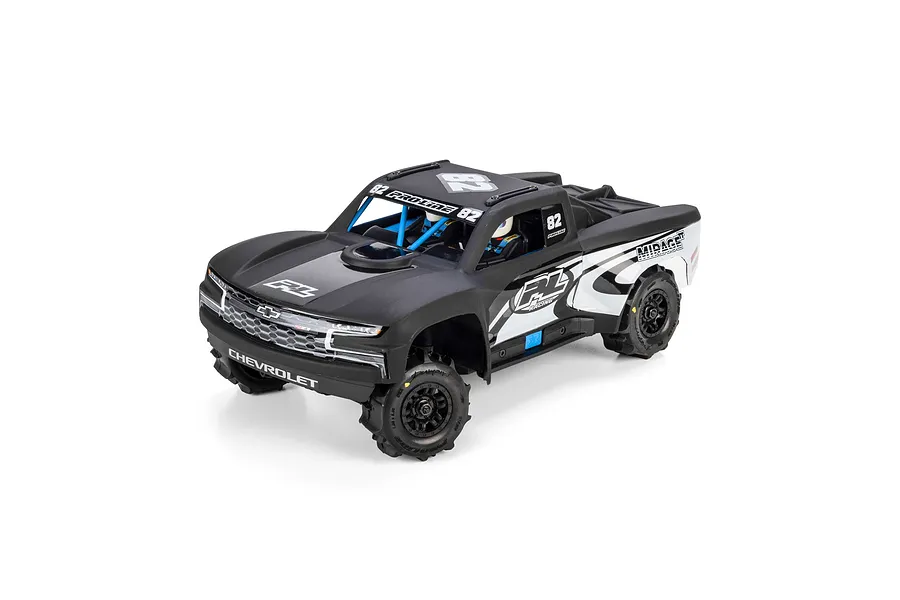 Pro-Line 2019 Chevy Silverado Trophy Truck body shell in matte black mounted on an RC chassis with wheels against a white background.