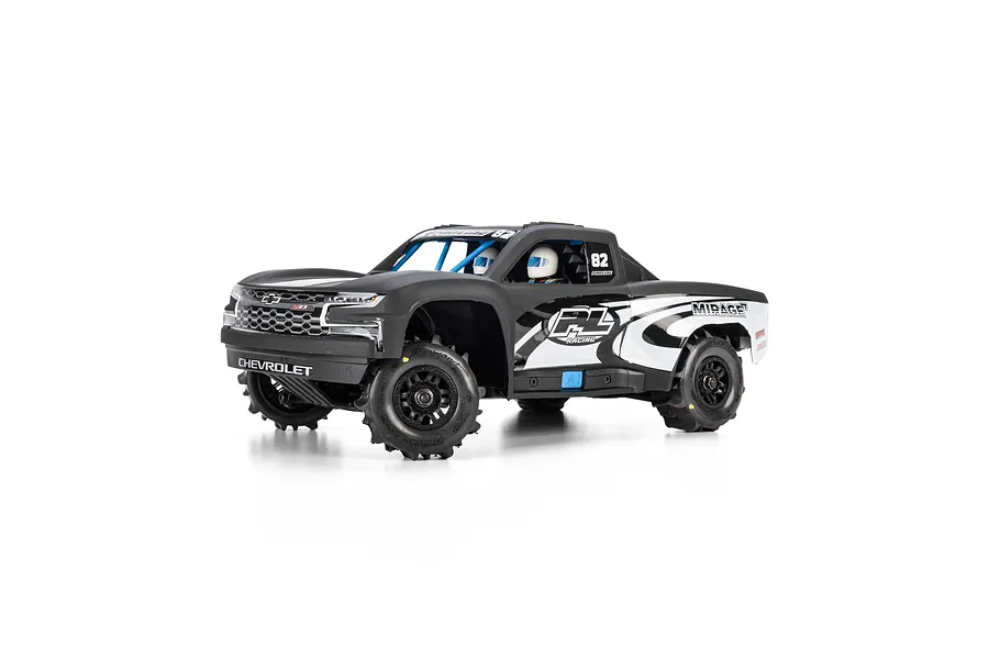 Pro-Line matte black 2019 Chevy Silverado trophy truck body mounted on a small RC truck chassis against a white background.