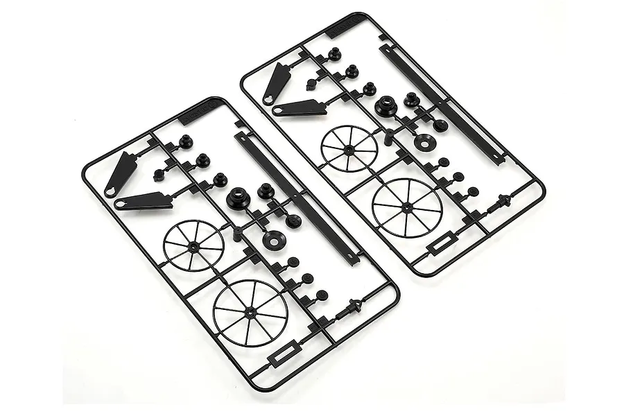 Two identical black plastic parts trees featuring small molded components and wheels against a plain white background.