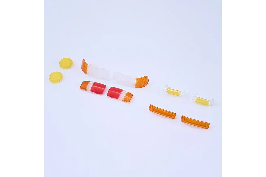 FMS 1/10 Toyota LC80 Landcruiser V1 Front and Rear Light Lens Set laid out on a white background