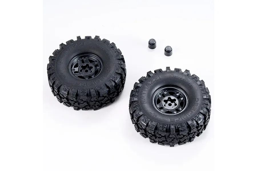 Two black RC crawler tyres mounted on black rims with two small plastic cap accessories on a white background.