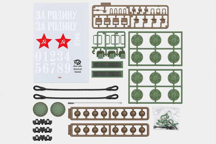 Top-down view of Heng Long Russian KV-2 tank accessory pack including decals, plastic parts sprues, tow cables, and detail components.