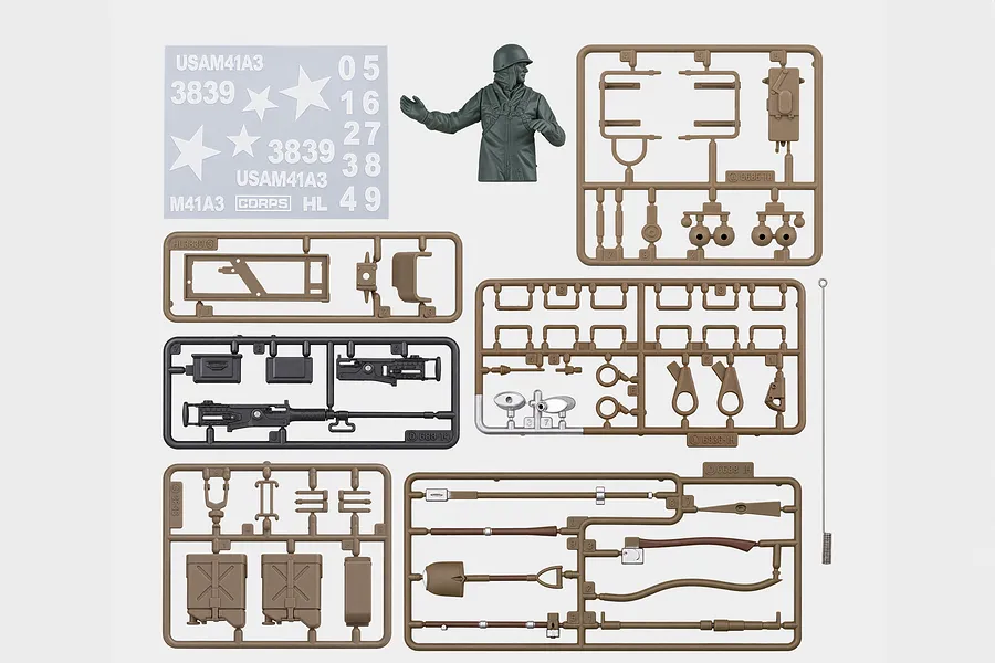 Heng Long USA M41 tank accessory pack featuring plastic parts sprues, decals, commander figure, and antenna on a white background.