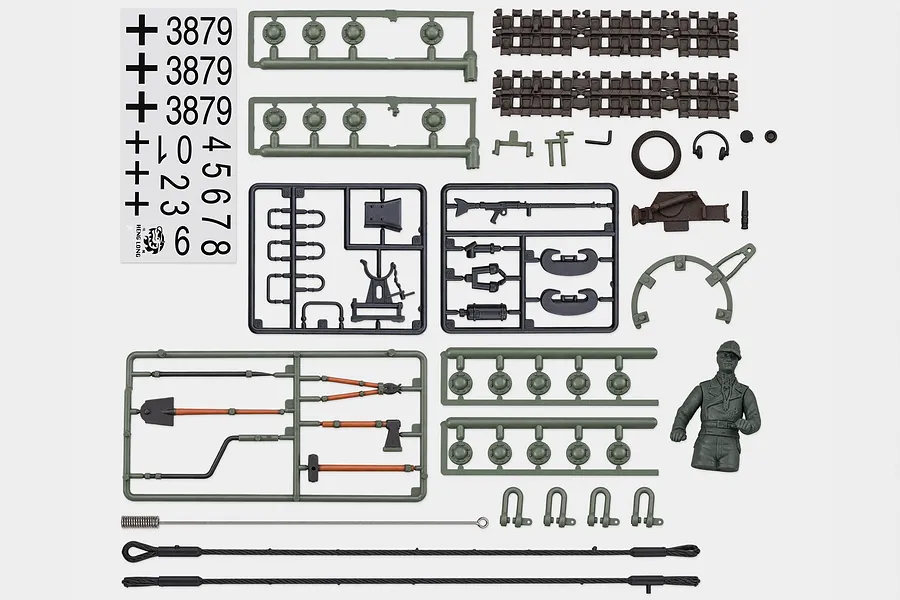 Top-down view of Heng Long RC German Panther Type G tank accessory pack parts, including decals, plastic sprues, tools, and a commander figure.