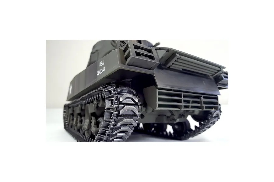 Low angle rear view of the green Taigen RC tank showing detailed tracks and exhaust grilles against a white background.