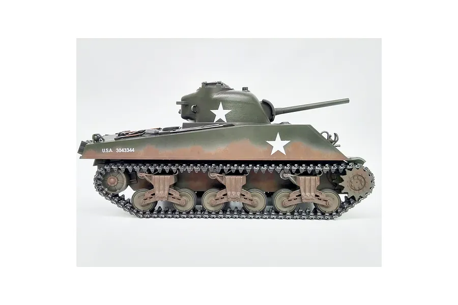 Side view of Taigen M4A3 Sherman RC tank in green camouflage with white star markings against a plain white background.