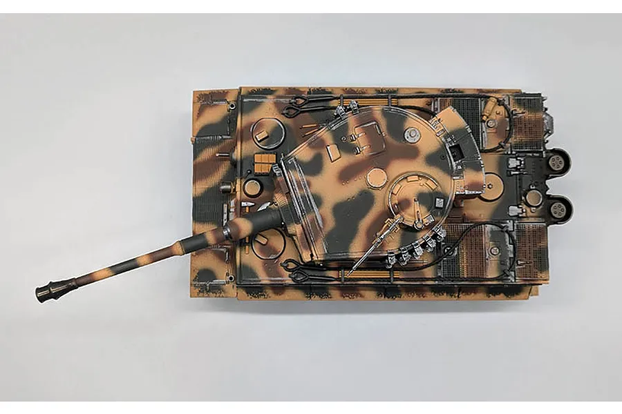 Top-down view of the Taigen German Tiger I RC tank with a brown and tan camouflage paint scheme on a light background.