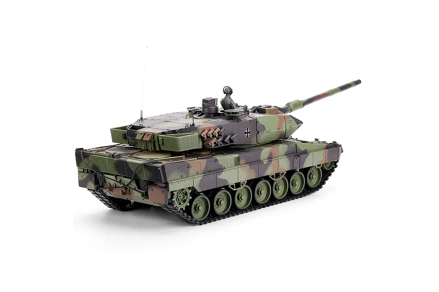 Taigen German Leopard 2A6 RC tank in three-tone camouflage with commander figure against a white background.
