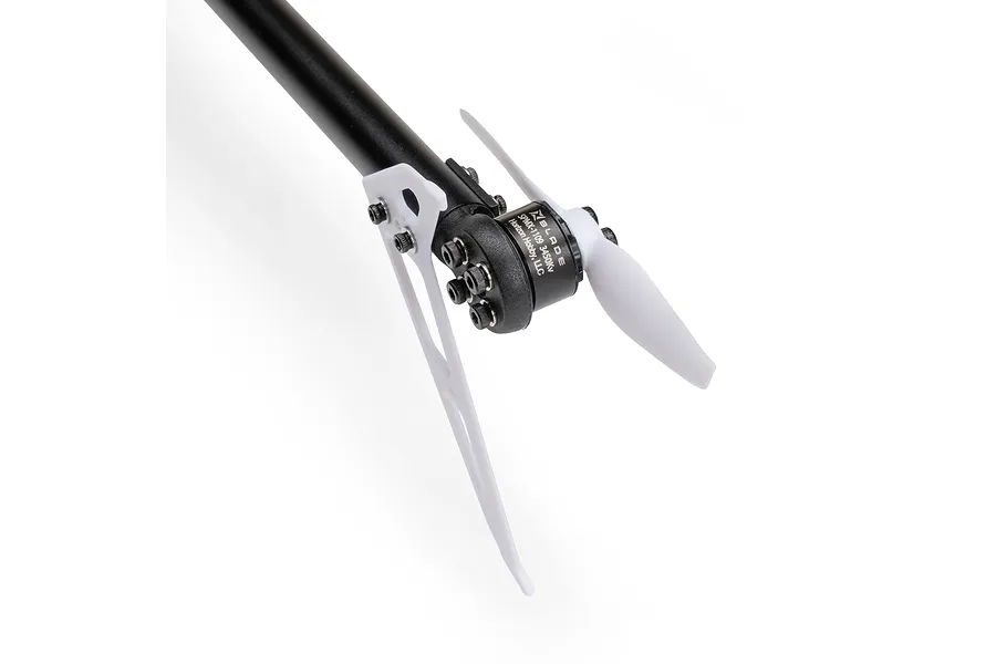Close-up of an RC helicopter tail rotor assembly featuring a black motor, white blades, and carbon fiber tail boom on a white background.