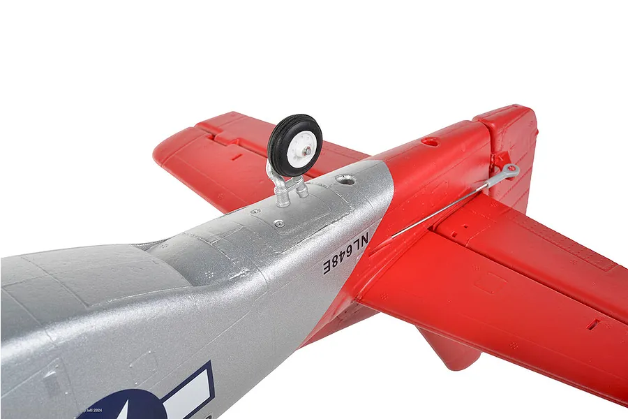 Close-up of the landing gear and rear wing section of the silver and red Arrows RC P-51 Mustang model plane.
