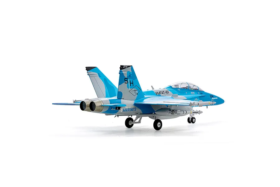 Rear-three-quarter view of the FMS F/A-18 Hornet RC jet in blue and grey camouflage livery with landing gear deployed on a white background.