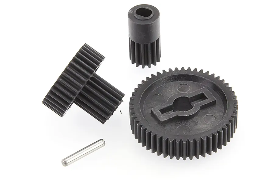 A set of black plastic RC car transmission gears and a small metal pin on a white background.