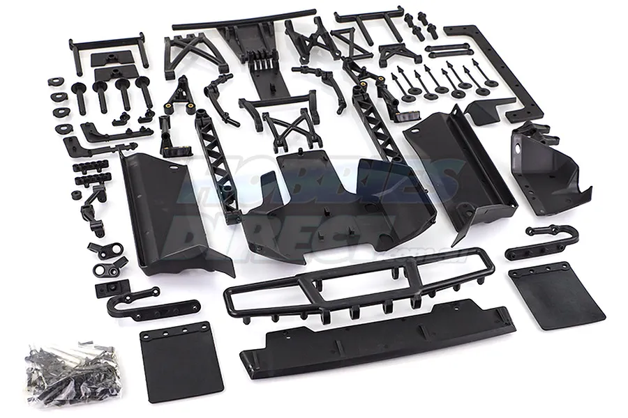 A collection of black plastic RC car parts for a Rovan Baja 5B to 5SC conversion kit, including bumpers, mud flaps, and chassis components.