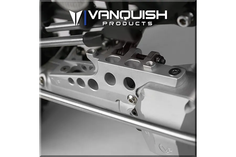 Close-up of a silver aluminium Vanquish Products differential truss installed on an RC vehicle axle assembly.