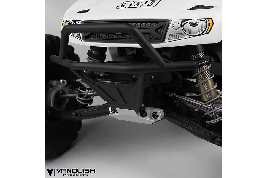 Close-up of a Vanquish silver aluminium front skid plate installed on an RC vehicle chassis.