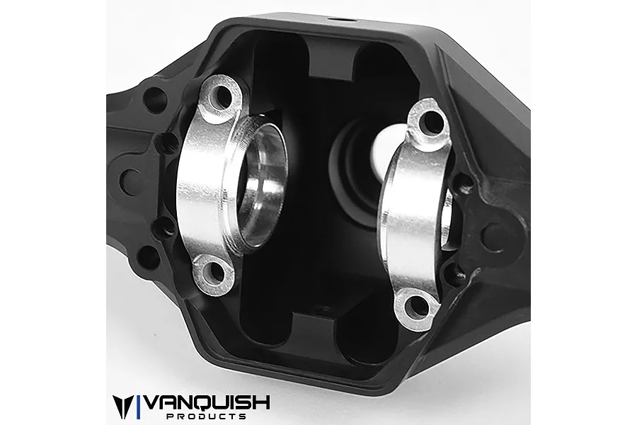 Close-up of the interior of a black anodized aluminium differential housing for an RC vehicle, showing silver bearing caps.