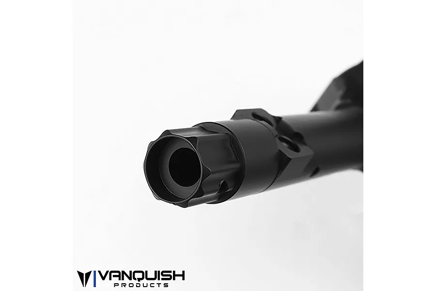 Close-up of a black anodized aluminium axle housing end for an RC vehicle, showing the machined detail and mounting points.