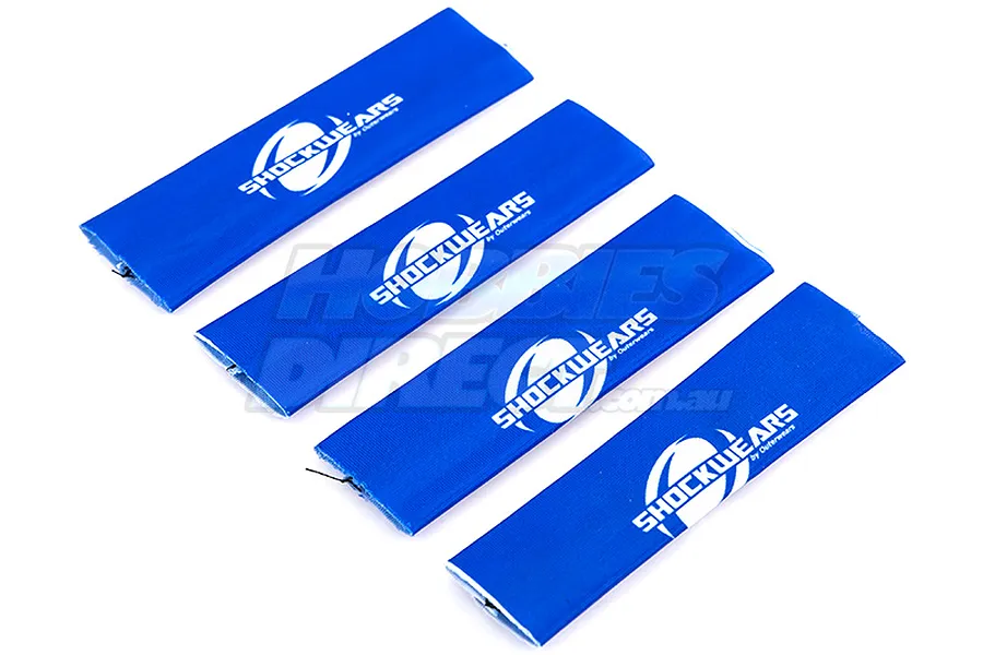 Four blue Outerwears Shockwears shock covers laid out diagonally on a white background.