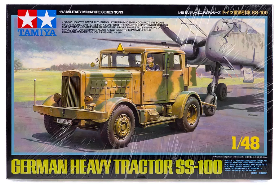 Tamiya 1/48 scale German SS-100 Heavy Tractor model kit box art showing the truck towing an aircraft on an airfield.