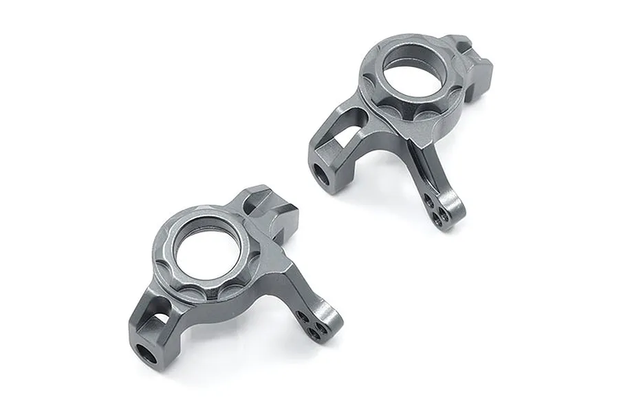 A pair of grey aluminium steering knuckles for an RC car, shown from a top-down angle against a white background.