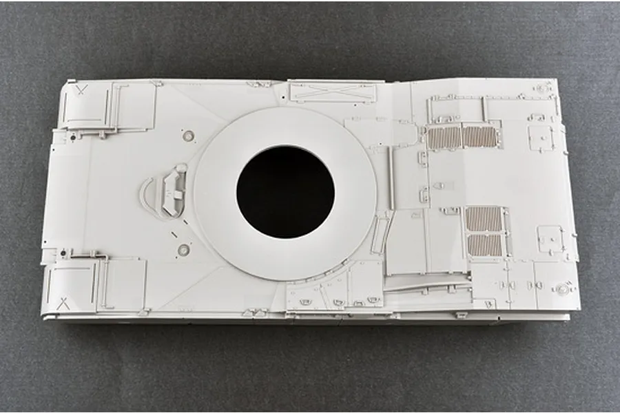 Top-down view of an unpainted grey plastic model tank hull part for a 1/16 scale M1 Abrams kit.