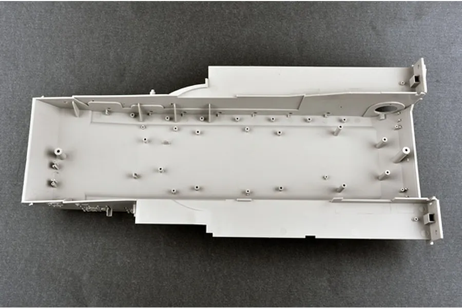 Top-down view of a grey plastic tank hull model part from a Trumpeter 1/16 scale kit.