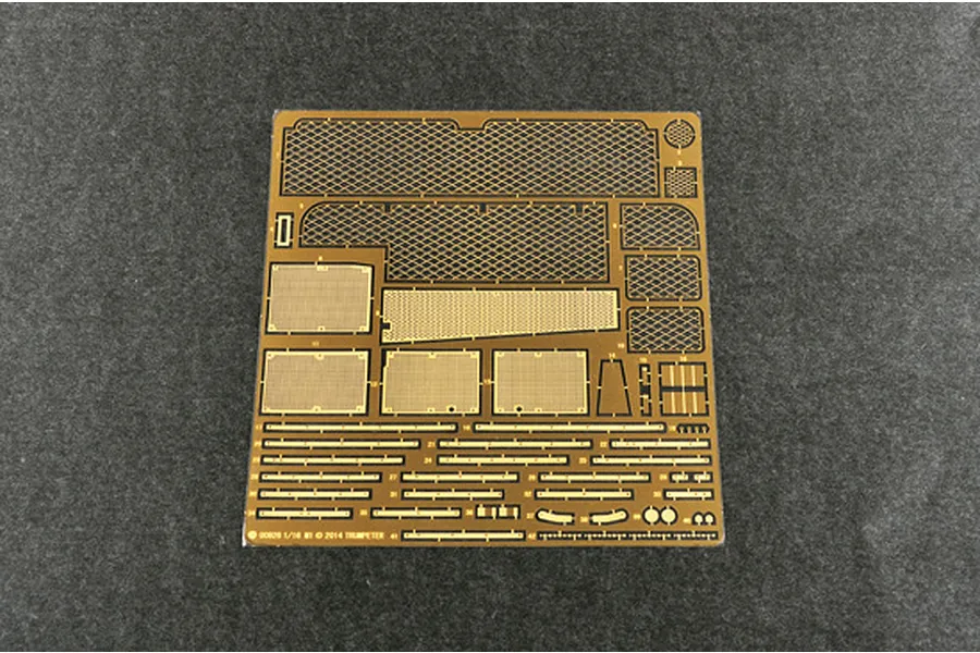 A photo-etched brass detail sheet for a 1/16 scale model tank kit, featuring various mesh screens and small structural parts.