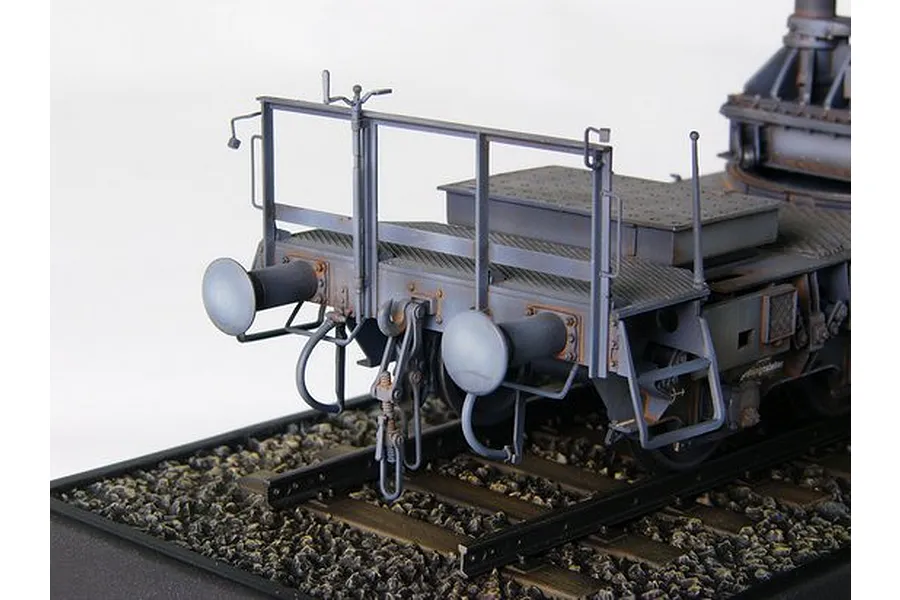 Close-up of the rear end of a 1/35 scale model railway transport carrier for the Morser Karl self-propelled gun, featuring detailed buffers and railings.