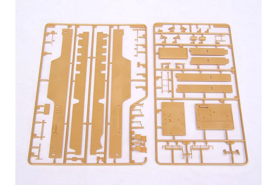 Two tan plastic model kit sprues containing various flat panels and small parts for a 1/35 scale military vehicle model.