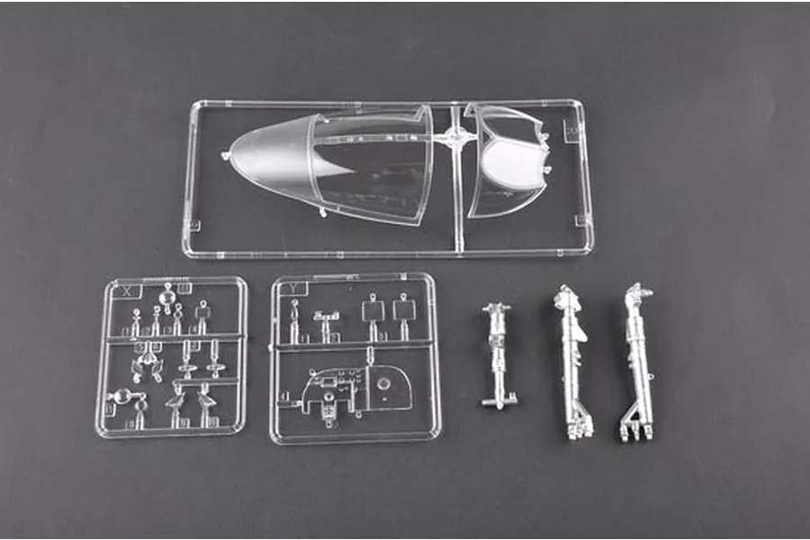 Clear plastic model kit sprues and metal landing gear parts for a 1/32 scale A-6A Intruder model aircraft.
