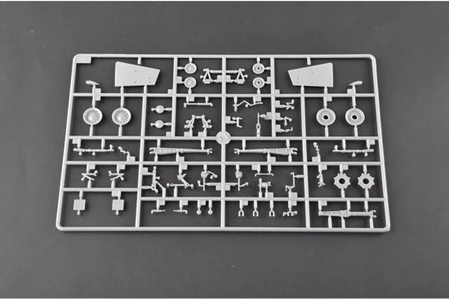 A grey plastic sprue containing various model aircraft parts, including landing gear components and wheels, for a 1/32 scale model kit.