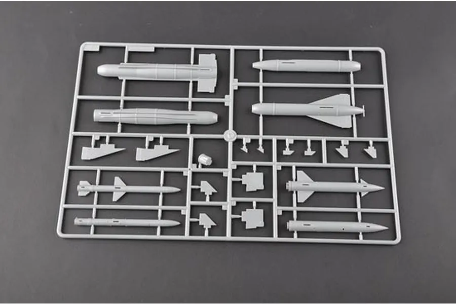 A grey plastic sprue containing various unpainted model aircraft missile and weapon parts for a 1/32 scale model kit.