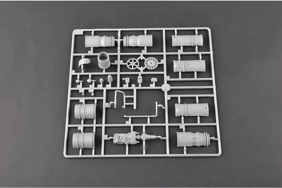 A grey plastic sprue containing various model aircraft engine and mechanical parts for a 1/32 scale model kit.