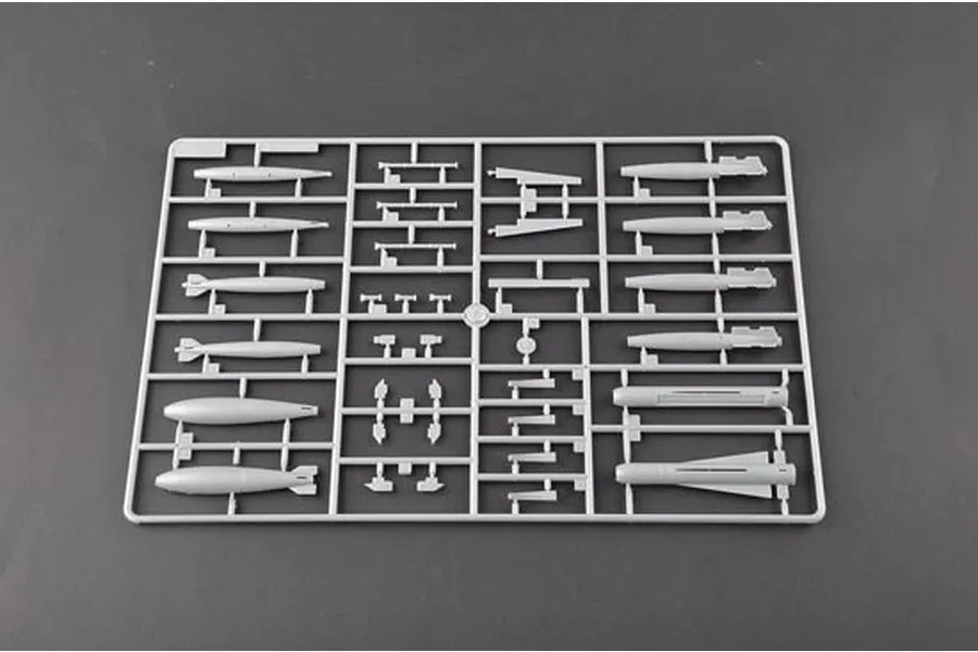 A grey plastic model kit sprue containing various aircraft ordnance and missile parts for a 1/32 scale model.
