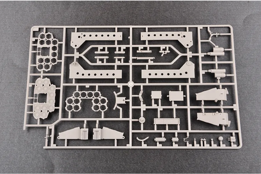 A light grey plastic model kit sprue containing various parts for a 1/35 scale military vehicle model.
