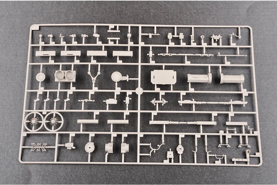 A light grey plastic model kit sprue containing various small vehicle parts for a 1/35 scale military model.