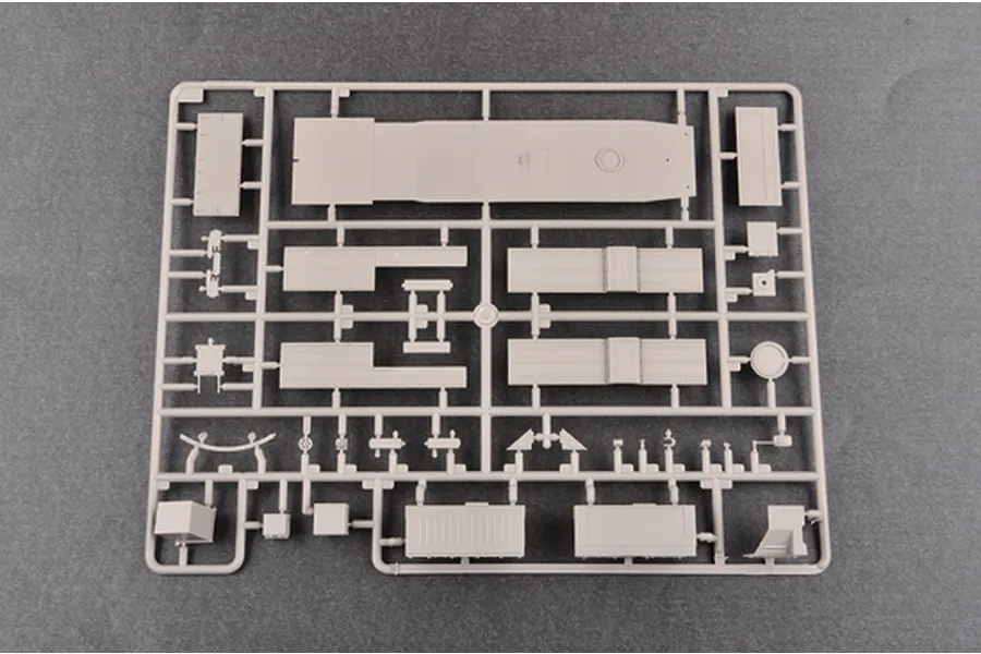 A grey plastic model kit sprue containing various vehicle parts for a 1/35 scale military model.
