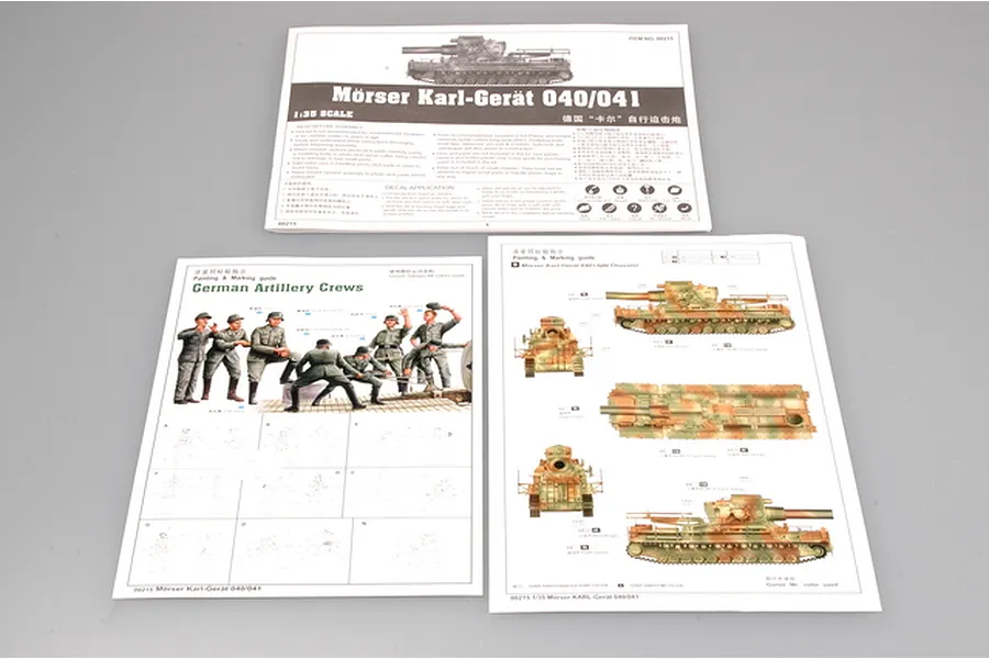 Instruction manuals and painting guides for the Trumpeter 1/35 scale Mörser Karl-Gerät 040/041 model kit laid out on a grey surface.
