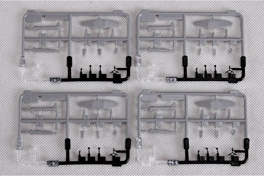Four identical grey and black plastic model kit sprues containing miniature aircraft parts for a 1/350 scale model.