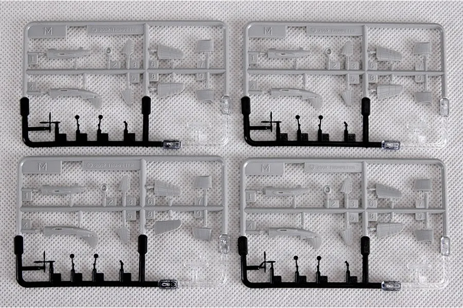 Four identical grey plastic model kit sprues containing small aircraft parts for a 1/350 scale model.