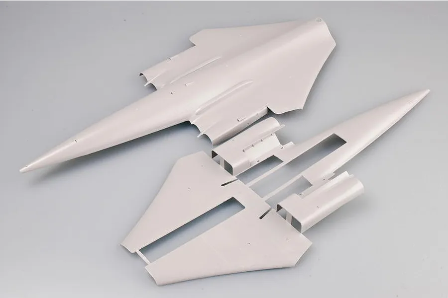 Unassembled grey plastic model aircraft fuselage parts for a Trumpeter 1/72 TU-160 Blackjack bomber kit.